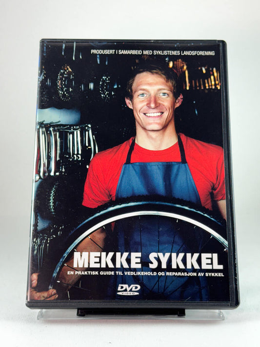 Forside av filmcover til Mekke sykkel, brukt DVD med praktisk sykkelguide hos Brukbar Film