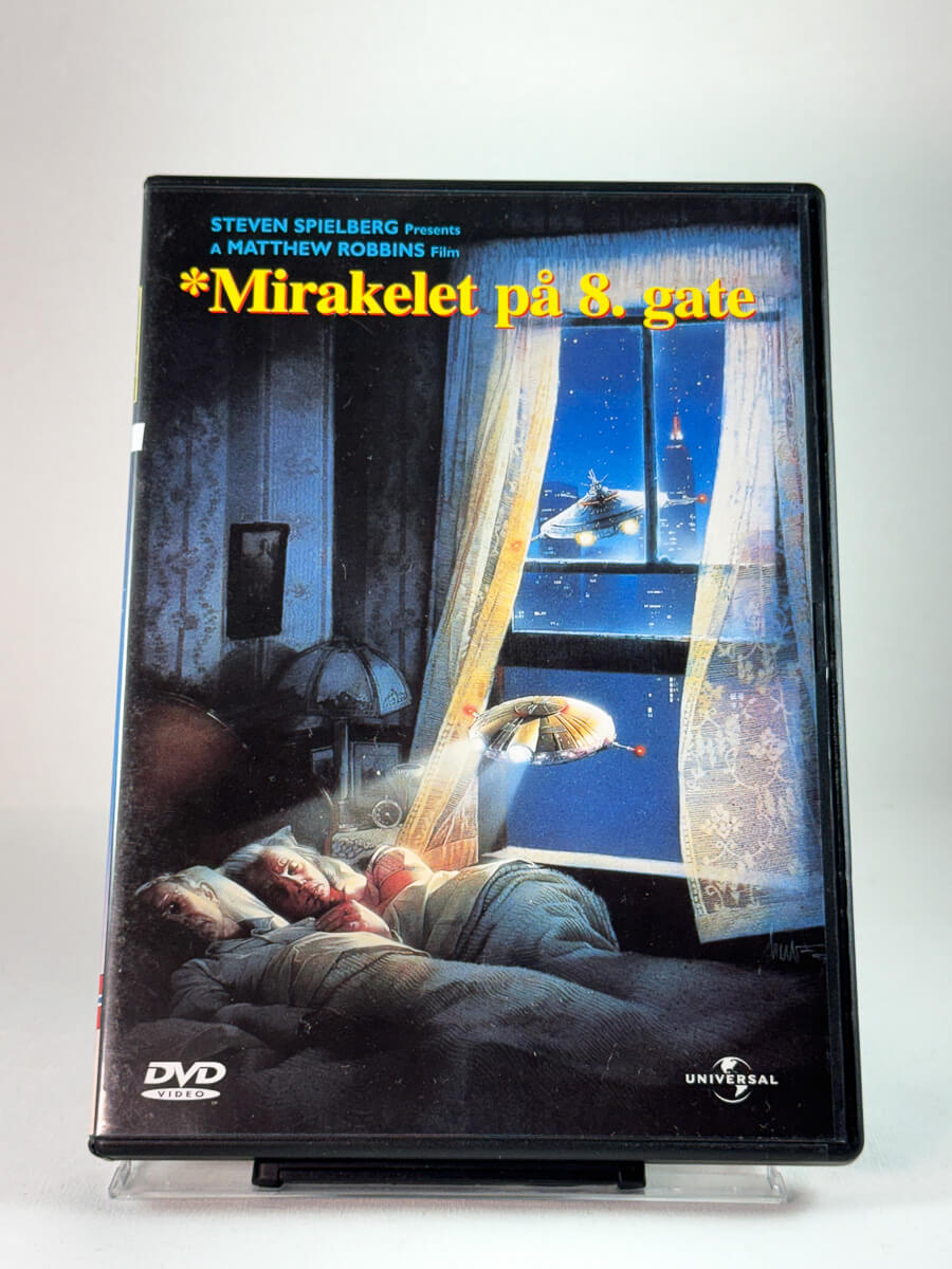 Forside av DVD-cover til Mirakelet på 8. gate med ikonisk Spielberg-presentert motiv; brukt sci-fi/familiefilm på DVD hos Brukbar Film
