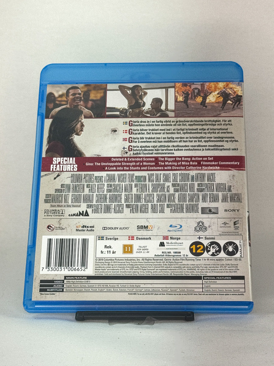 Bakside av Blu-ray-cover til Miss Bala – stilfull actionfilm med Gina Rodriguez i en intens kamp for frihet, brukt Blu-ray hos Brukbar Film.