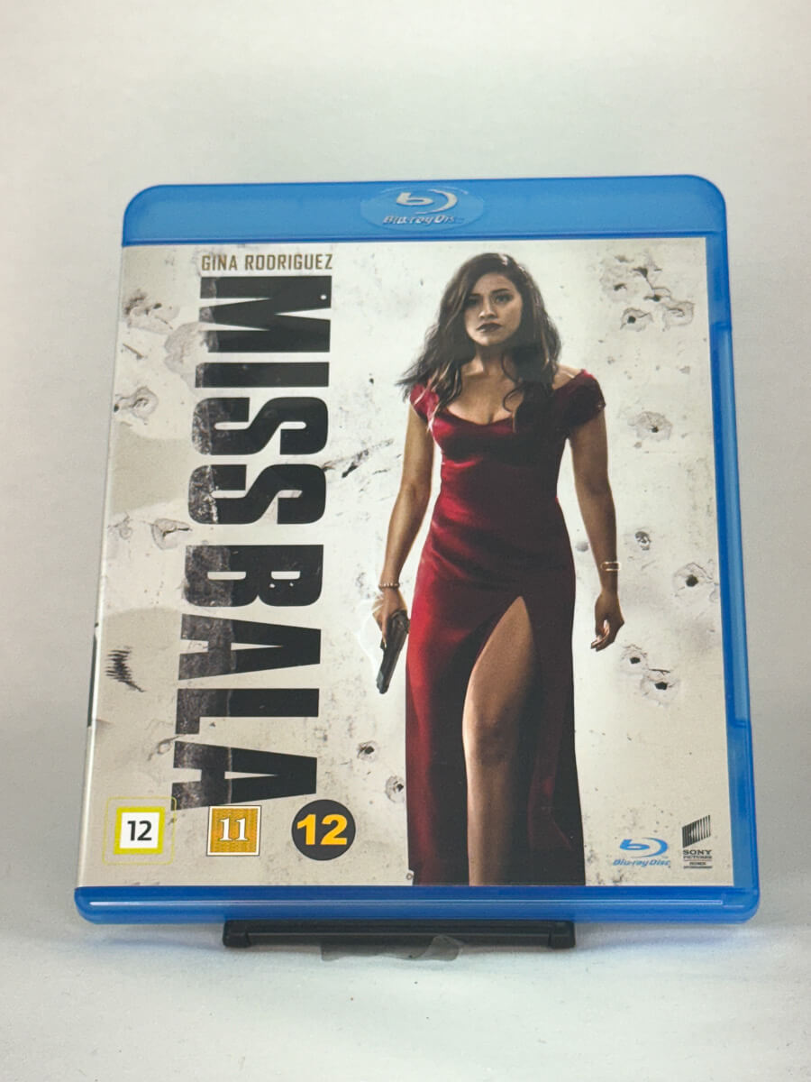 Forside av Blu-ray-cover til Miss Bala med Gina Rodriguez – eksplosiv actionthriller om overlevelse i narkokrigens Mexico, brukt Blu-ray hos Brukbar Film.