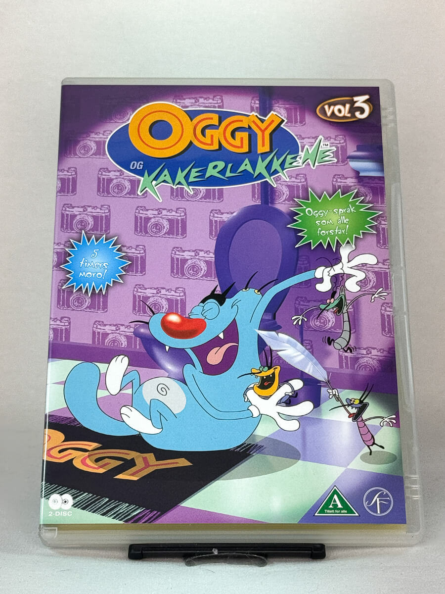 Forside av DVD-cover til Oggy og kakerlakkene Vol. 3 – tegneserieklassiker med humor for hele familien, brukt DVD hos Brukbar Film.