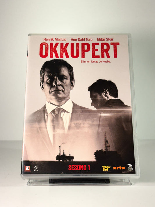 Forside av cover til Okkupert – Sesong 1, bruktfilm på DVD hos Brukbar Film
