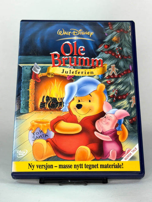 Forside av DVD-cover til Ole Brumm – Juleferien – hjertevarm Disney-fortelling med norsk tale, full av julestemning – brukt DVD tilgjengelig hos Brukbar Film.