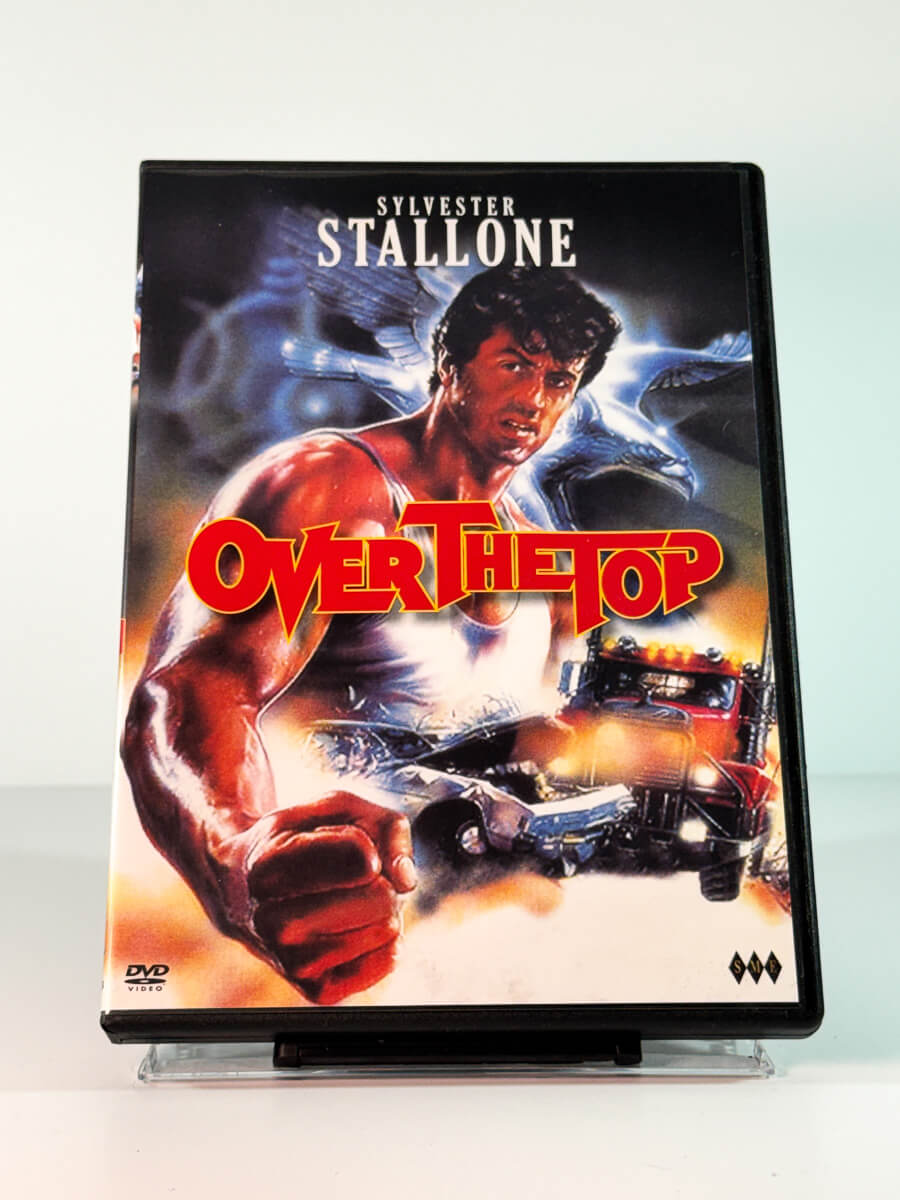 Forside av cover til Over the Top, bruktfilm på DVD hos Brukbar Film
