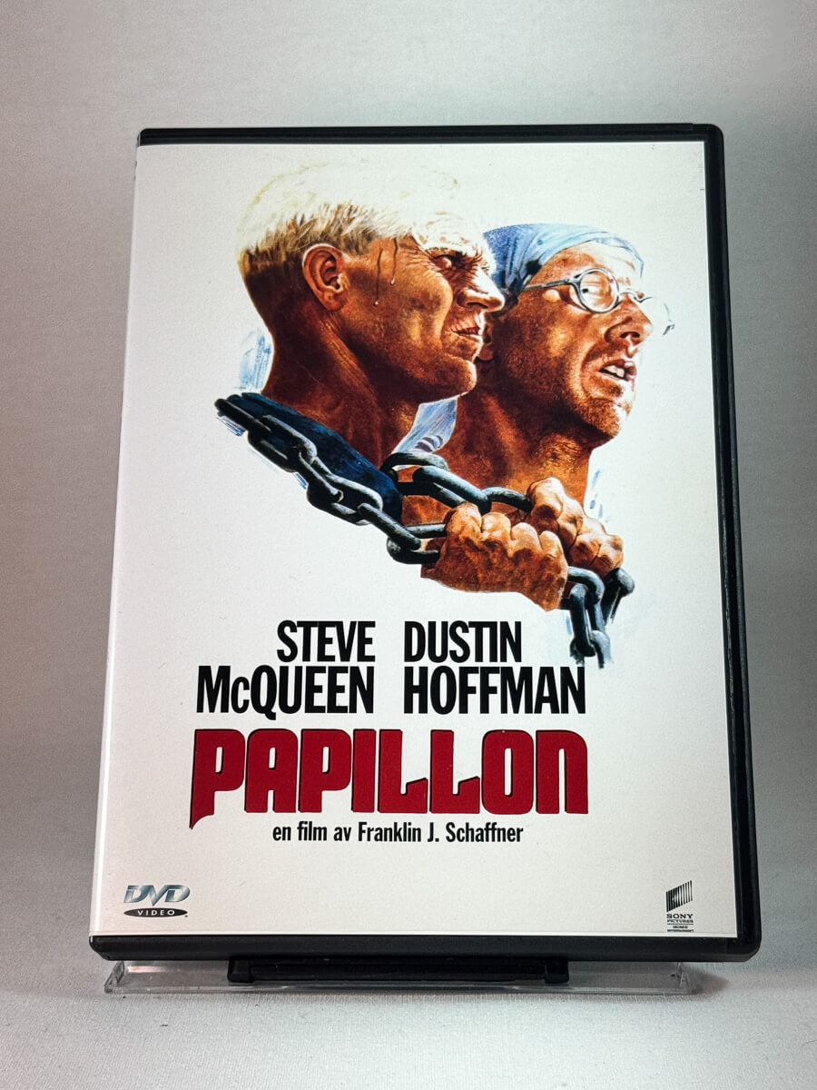 Forside av cover til Papillon, bruktfilm hos nettbutikken Brukbar Film