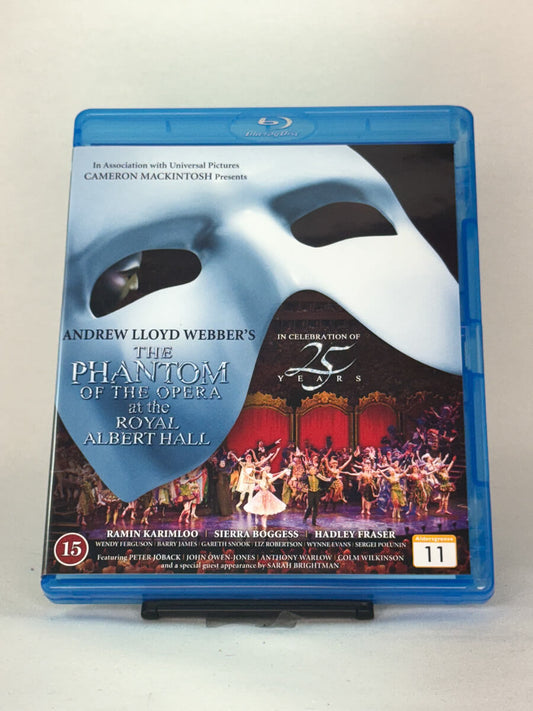 Forside av Blu-ray-cover til The Phantom of the Opera at the Royal Albert Hall – 25-årsjubileet av Andrew Lloyd Webbers klassiske musikal, brukt Blu-ray hos Brukbar Film.