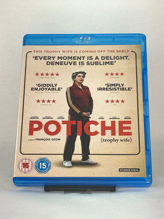 Forside av Blu-ray-cover for Potiche (Trophy Wife) – fransk komedie med Catherine Deneuve og Gérard Depardieu, brukt Blu-ray hos Brukbar Film.