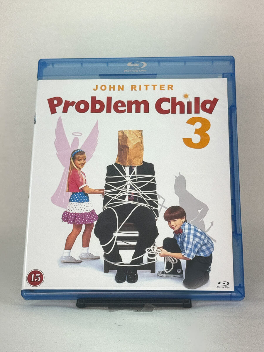 Forside av Blu-ray-cover til Problem Child 3 – kaotisk familiefilm med John Ritter, full av rampestreker og humor, brukt Blu-ray hos Brukbar Film.
