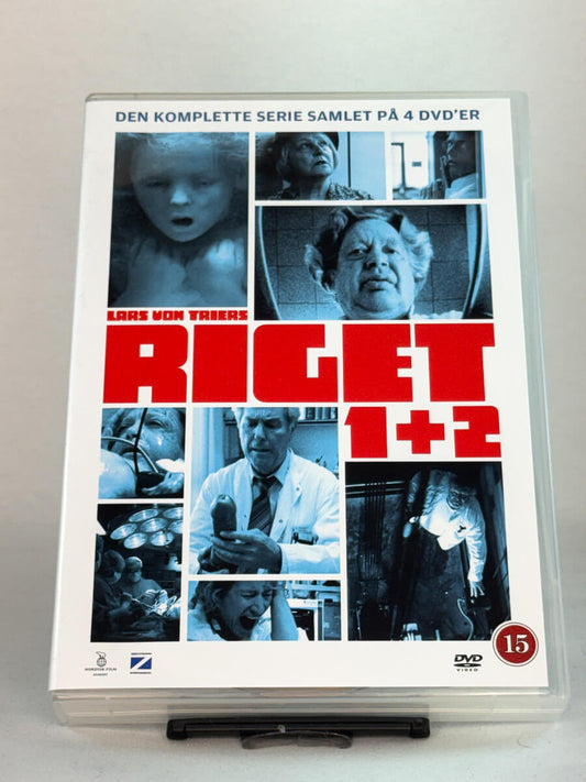 Forside av DVD-cover til Riget 1+2 – Lars von Triers kultklassiker fra 90-tallet, en mørk og absurd blanding av skrekk og sykehusdrama, komplett serie på brukt DVD hos Brukbar Film.