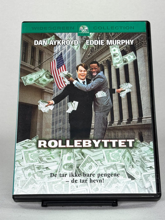 Forside av DVD-cover til Rollebyttet (Trading Places) – komedieklassiker med Eddie Murphy og Dan Aykroyd, brukt film fra Brukbar Film.