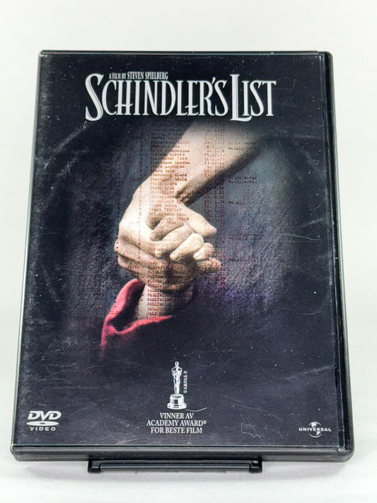 Forside av DVD-cover for Schindler’s List, Steven Spielbergs Oscar-belønte drama; brukt DVD-film og autentisk cover hos Brukbar Film.