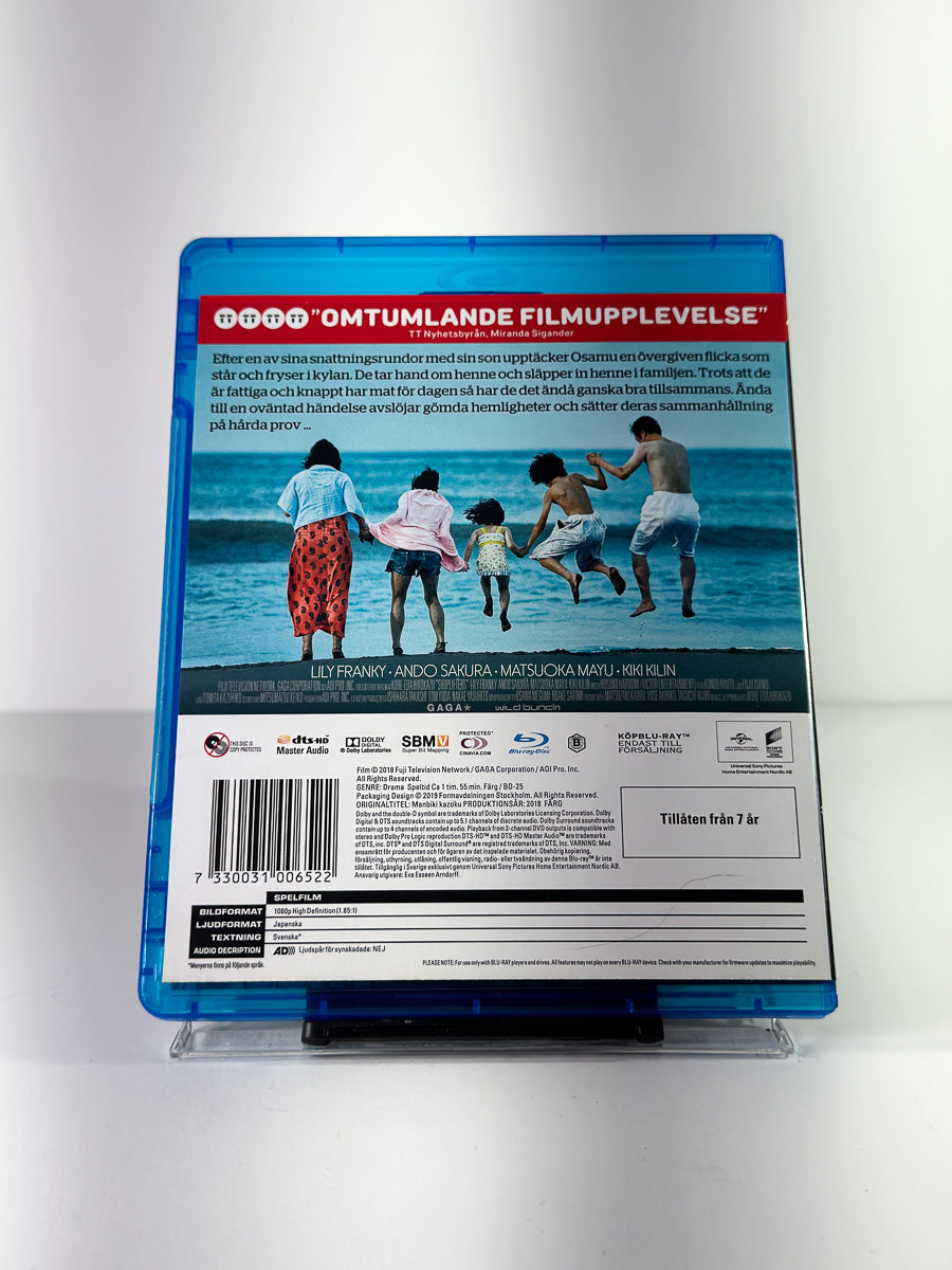 Bakside av cover til Shoplifters på Blu-ray