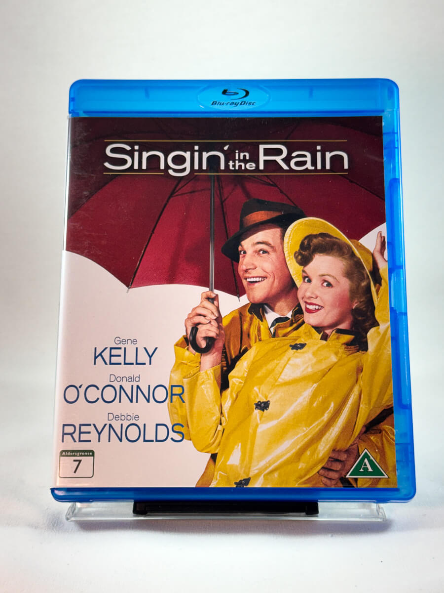 Singing in the Rain – forside av Blu-ray-cover, klassisk musikal med Gene Kelly, bruktfilm hos Brukbar Film