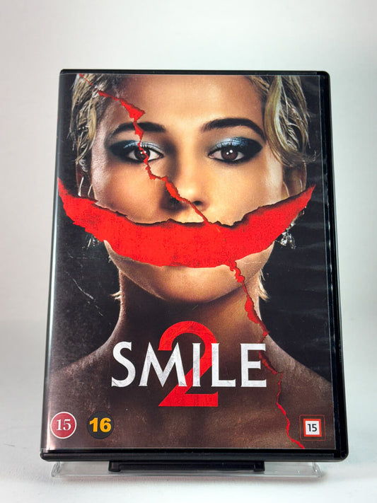Forside av DVD-cover til Smile 2, bruktfilm hos Brukbar Film