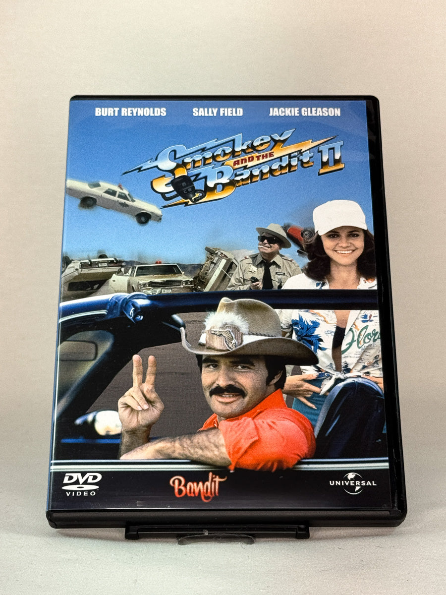 Forside av Smokey and the Bandit II (1980) med Burt Reynolds, Sally Field og Jackie Gleason – brukt DVD hos Brukbar Film