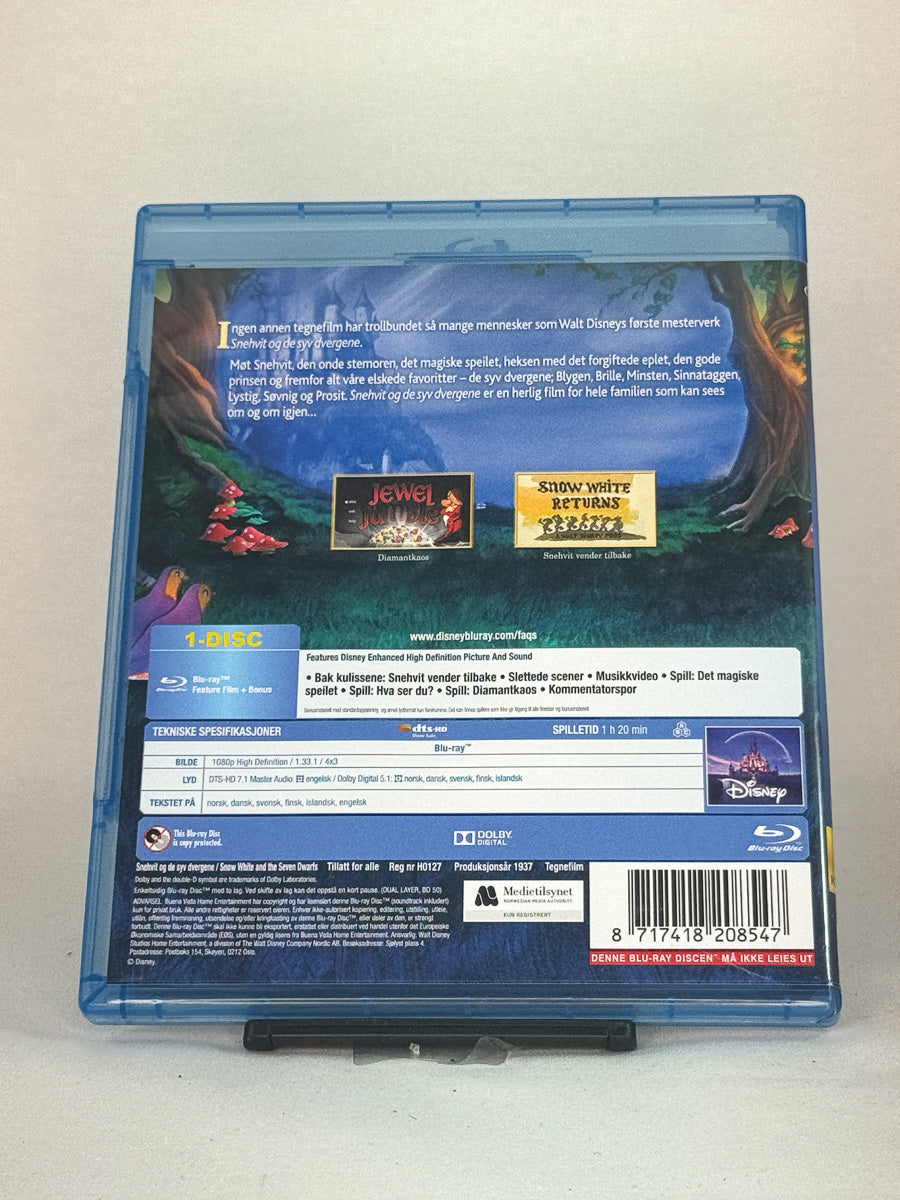 Bakside av Blu-ray-cover for Snehvit og de syv dvergene – brukt original Disney klassiker på Blu-ray, tilgjengelig hos Brukbar Film