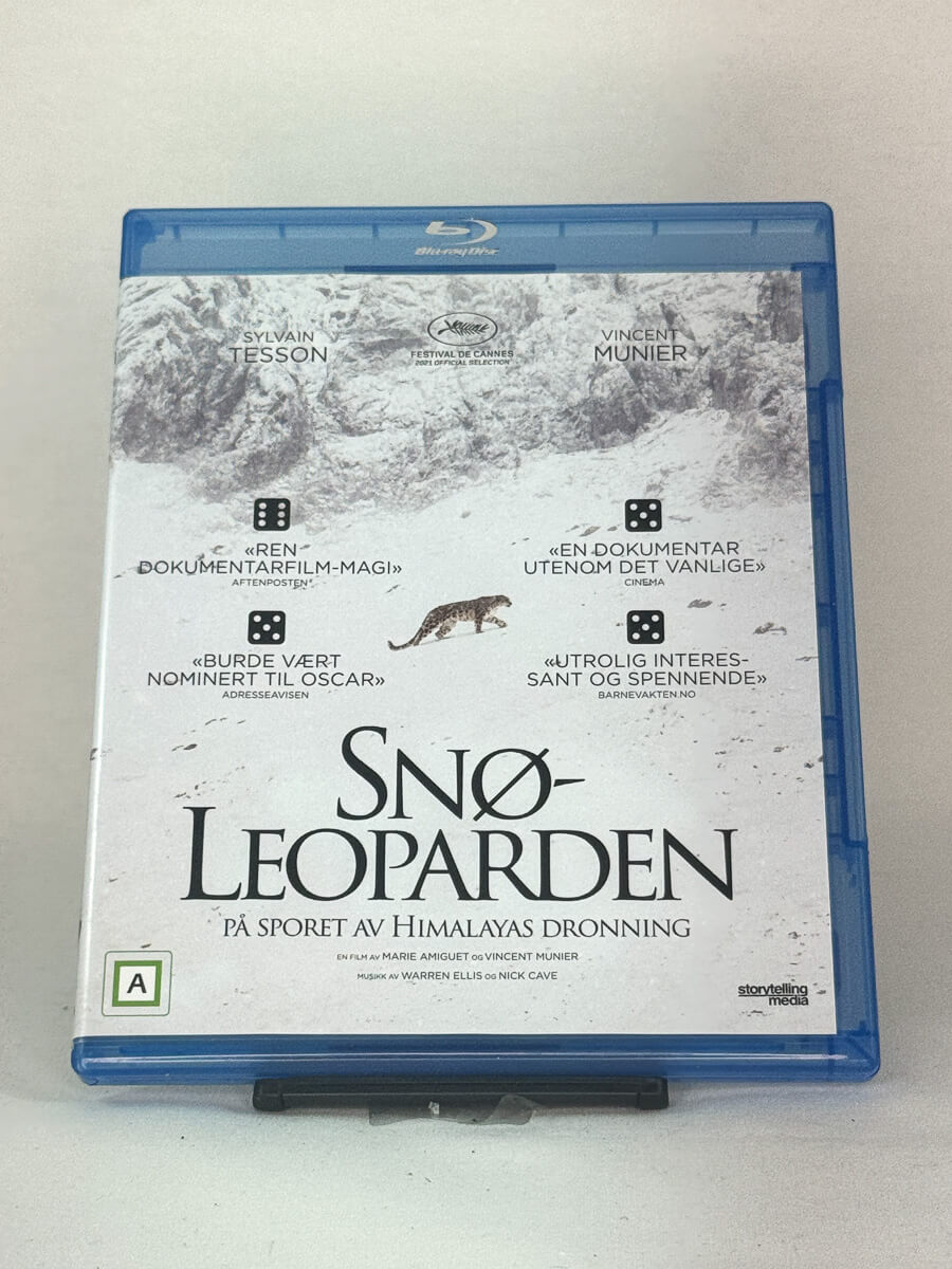 Forside av Blu-ray-cover til Snøleoparden – prisbelønt dokumentar fra Himalaya med musikk av Nick Cave, brukt film hos Brukbar Film.