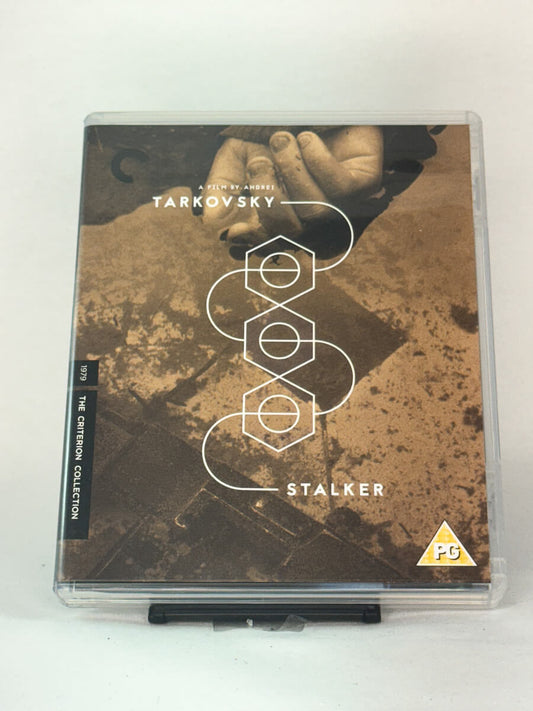 Forside av Blu-ray-cover for Stalker – Andrei Tarkovskys tidløse sci-fi-klassiker i Criterion Collection-utgave, brukt Blu-ray hos Brukbar Film.