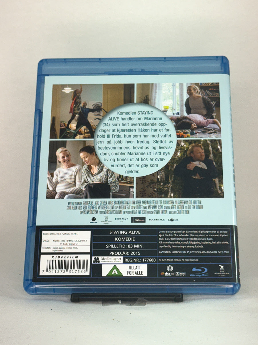 Bakside av Blu-ray-cover til Staying Alive – original norsk film på Blu-ray, brukt film hos Brukbar Film