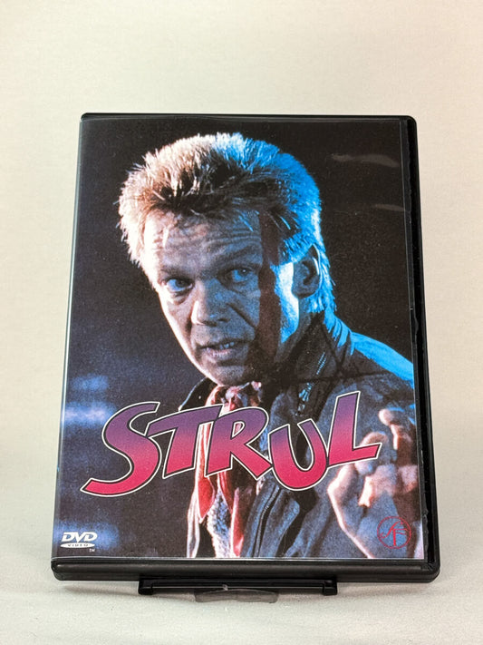 Forside av DVD-cover til Strul – svensk actionkomedie med Björn Skifs, brukt DVD hos Brukbar Film