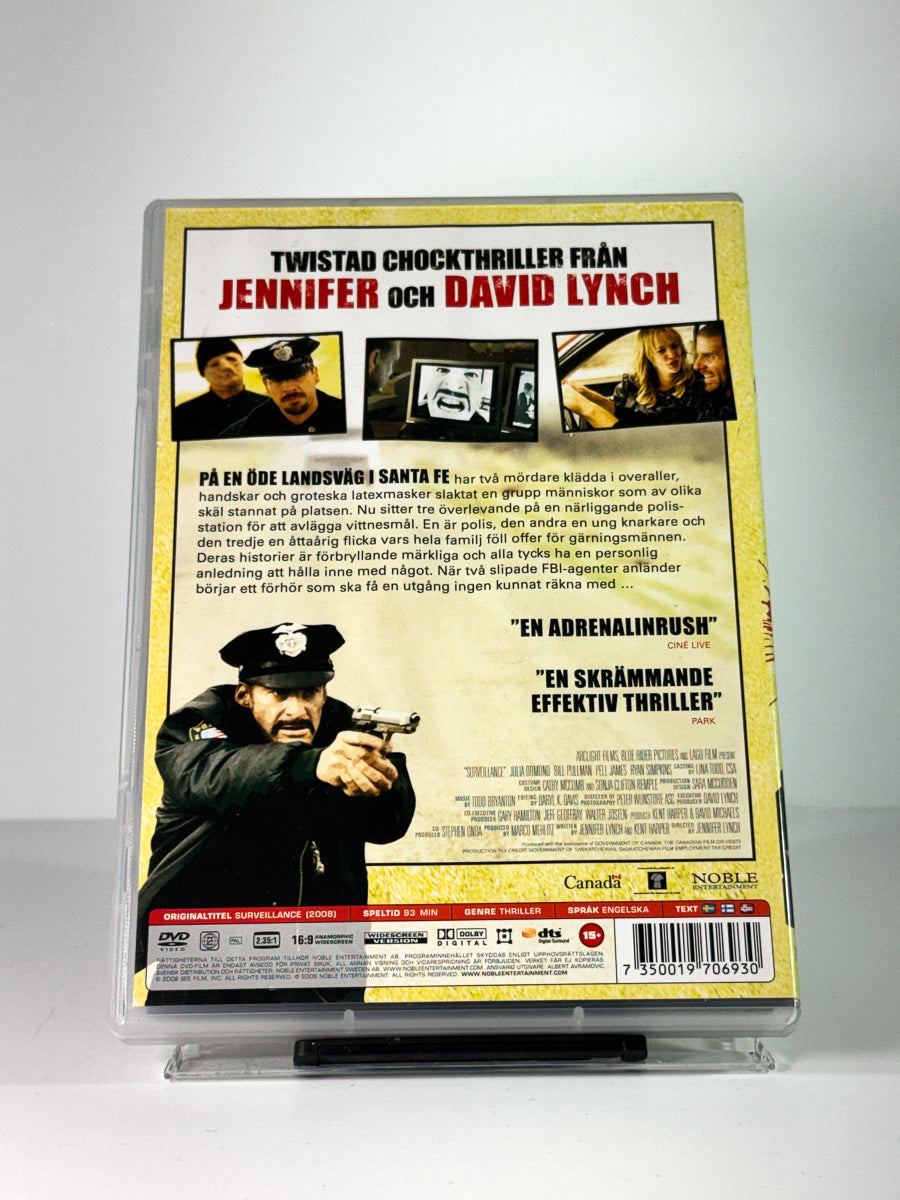 Bakside av cover til Surveillance, brukt original DVD hos Brukbar Film