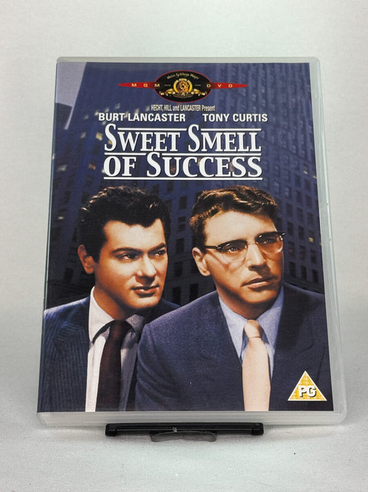 Forside av DVD-cover til Sweet Smell of Success – film noir-klassiker med Burt Lancaster og Tony Curtis, brukt DVD hos Brukbar Film.