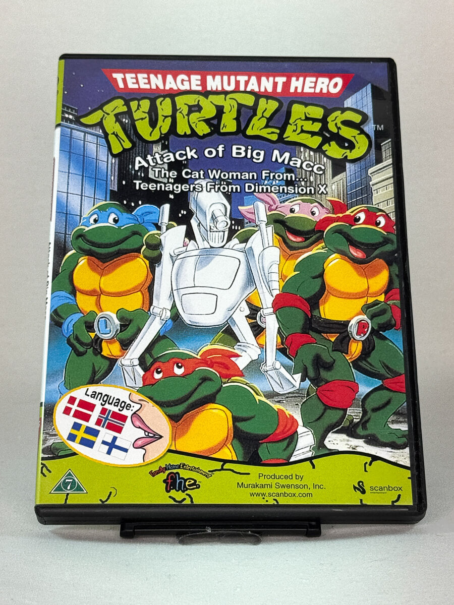 Forside av DVD-cover til Teenage Mutant Hero Turtles – Attack of Big Macc, brukt DVD med klassisk tegneserie fra Brukbar Film