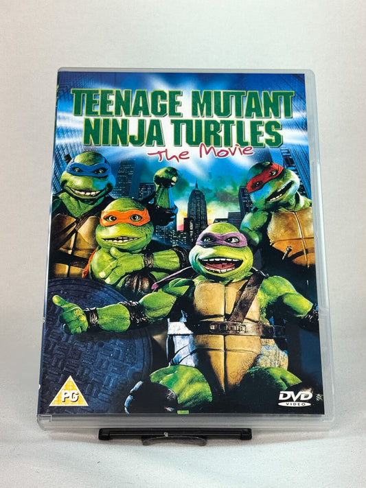 Forside av DVD-cover til Teenage Mutant Ninja Turtles: The Movie – klassisk actionkomedie fra 90-tallet med skilpaddeheltene, brukt film fra Brukbar Film