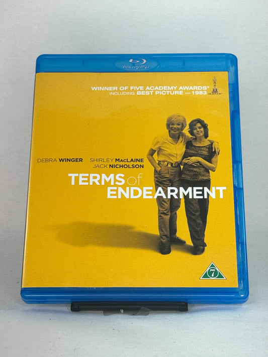 Forside av Blu-ray-cover til Terms of Endearment – prisbelønnet drama med Shirley MacLaine, Debra Winger og Jack Nicholson, brukt Blu-ray hos Brukbar Film.