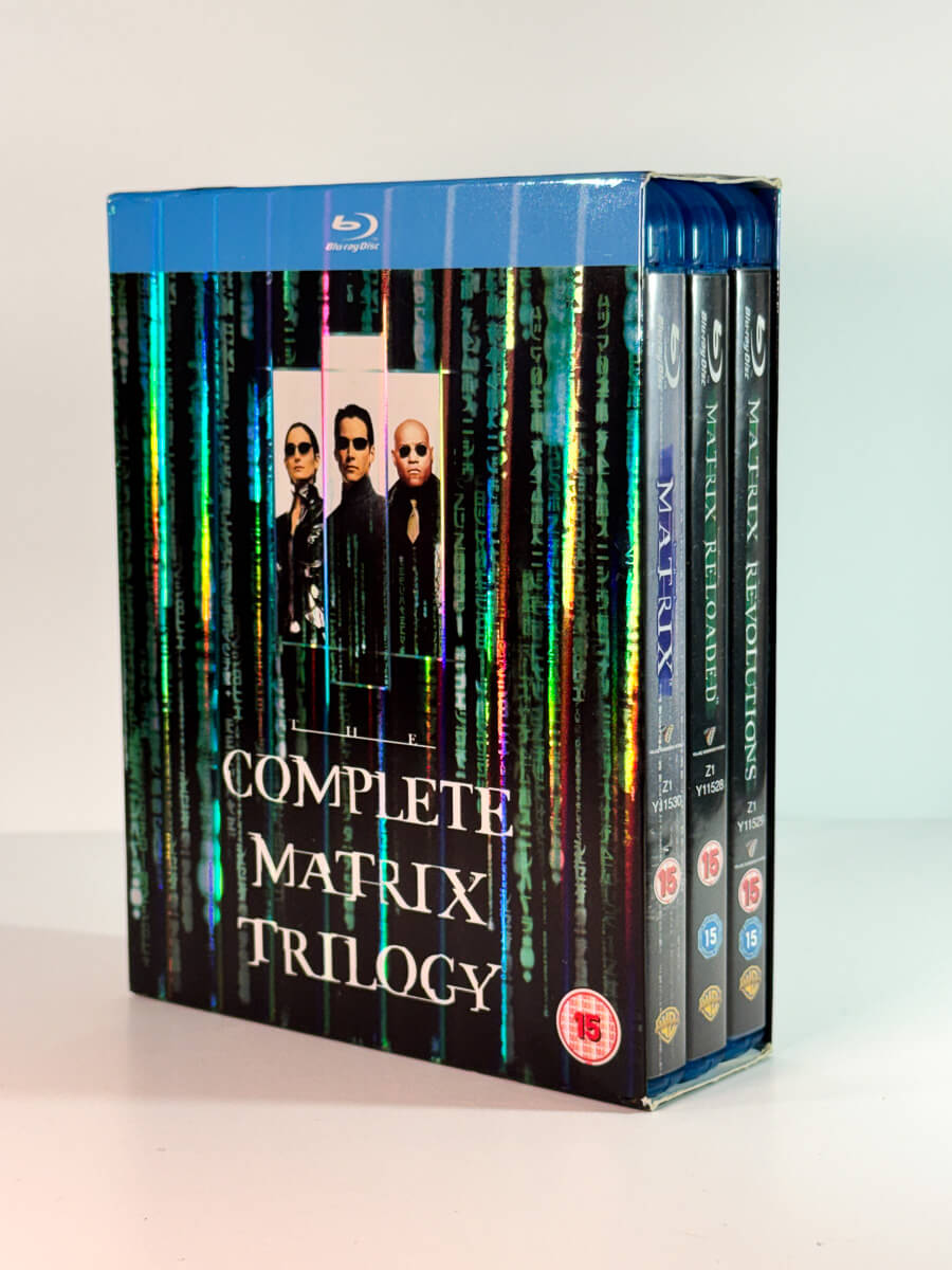 Forside av cover til The Complete Matrix Trilogy, brukt Blu-ray hos Brukbar Film