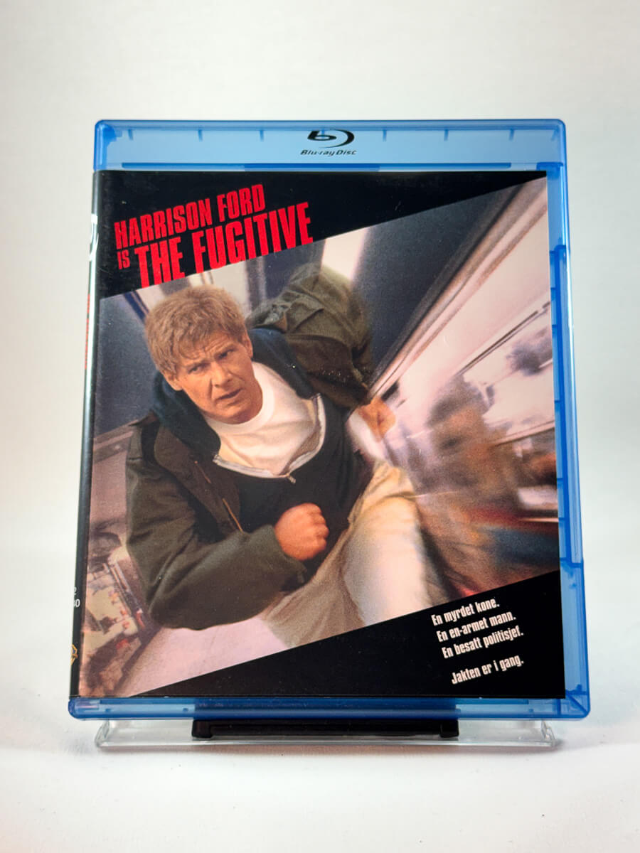 The Fugitive – forside av Blu-ray-cover, klassisk actionthriller med Harrison Ford, bruktfilm hos Brukbar Film