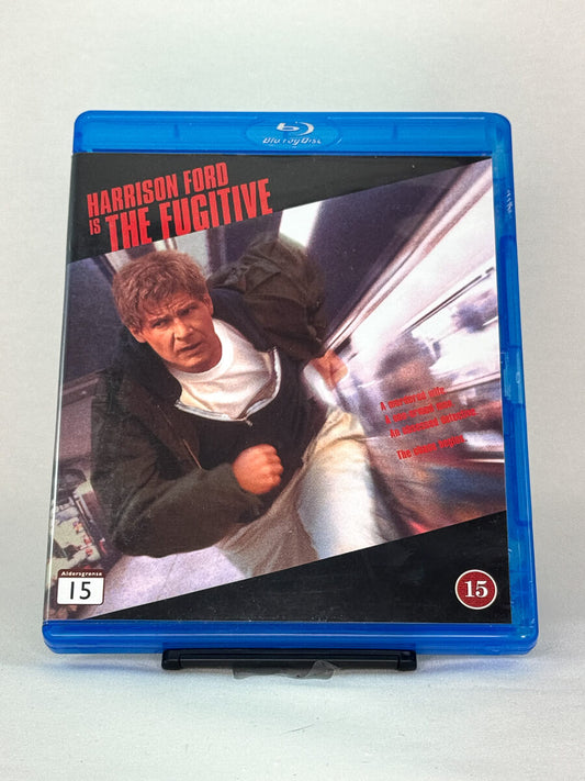 Forside av The Fugitive Blu-ray-cover – brukt actionthriller med Harrison Ford og Tommy Lee Jones, hos Brukbar Film
