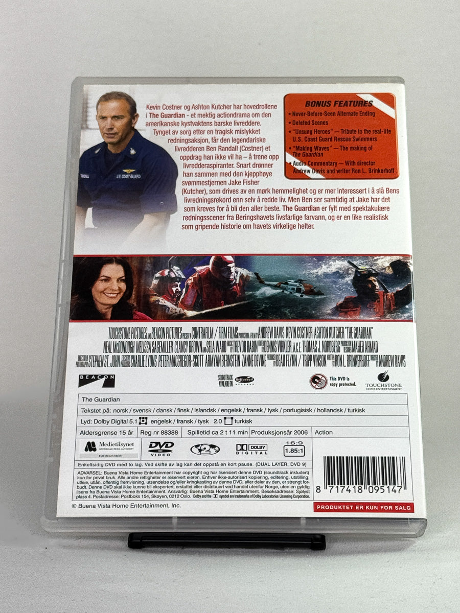 Bakside av DVD-cover til The Guardian – redningsdrama på havet med Kevin Costner og Ashton Kutcher – original brukt DVD hos Brukbar Film.