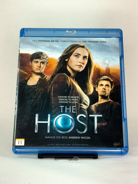 Forside av Blu-ray-cover til The Host – sci-fi-romantikk skrevet av Twilight-forfatter Stephenie Meyer, regissert av Andrew Niccol, brukt Blu-ray hos Brukbar Film.