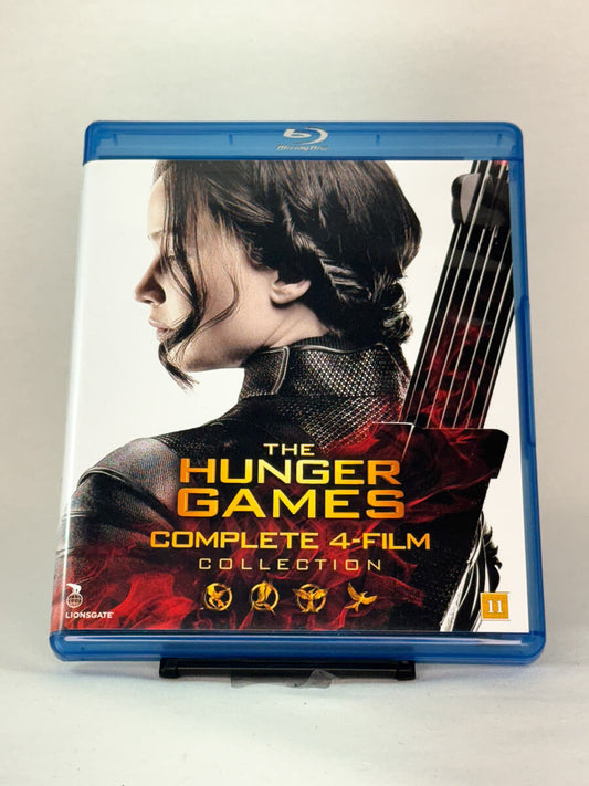 Blu-ray-cover-forside til filmserien The Hunger Games – Complete 4-Film Collection – Brukt Blu-ray fra nettbutikken Brukbar Film