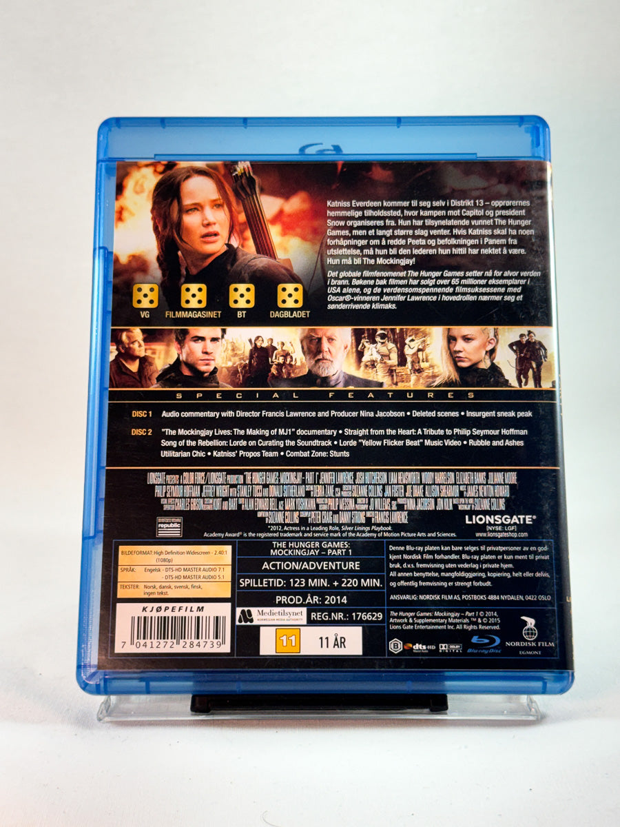 Bakside av Blu-ray-cover til The Hunger Games: Mockingjay – Part 1, bruktfilm på Blu-ray hos Brukbar Film