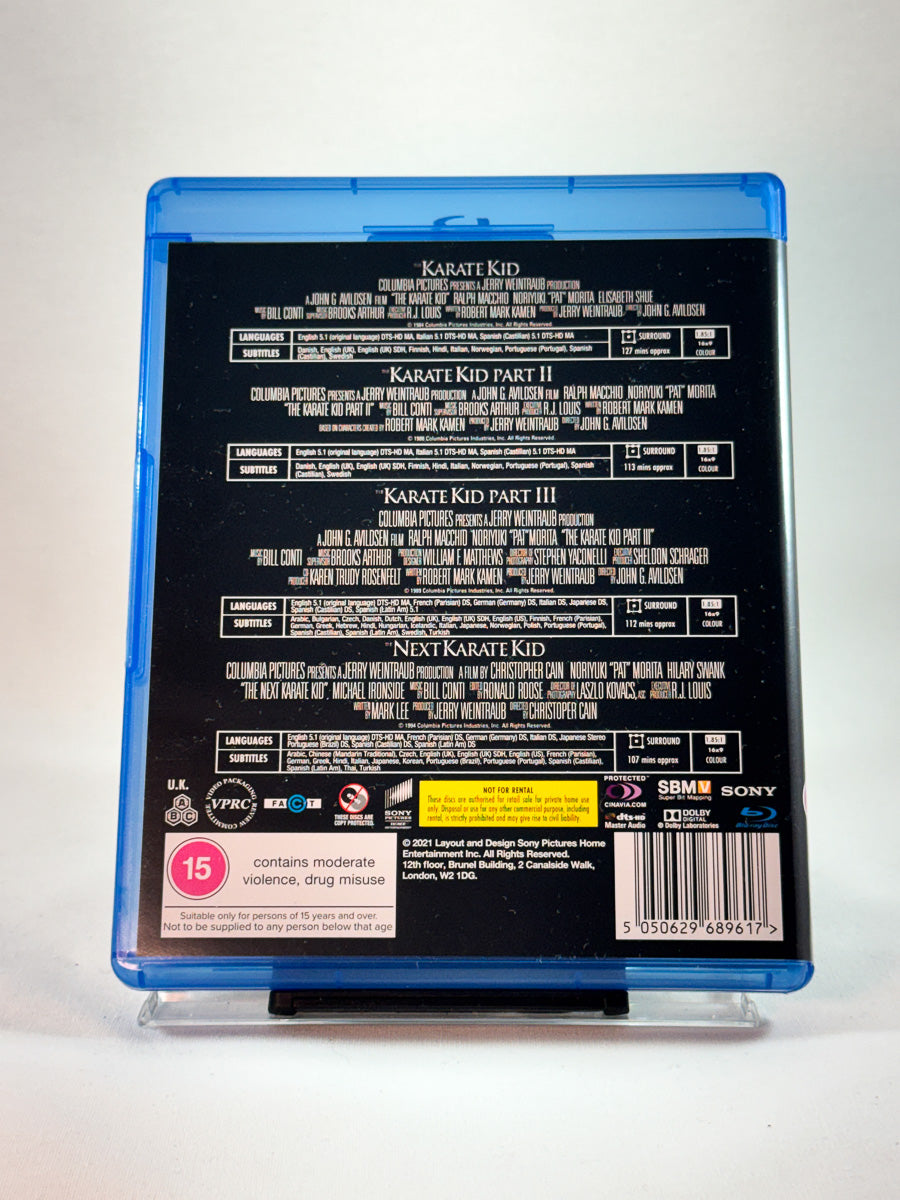Bakside av Blu-ray-cover til The Karate Kid Collection, brukt Blu-ray hos Brukbar Film