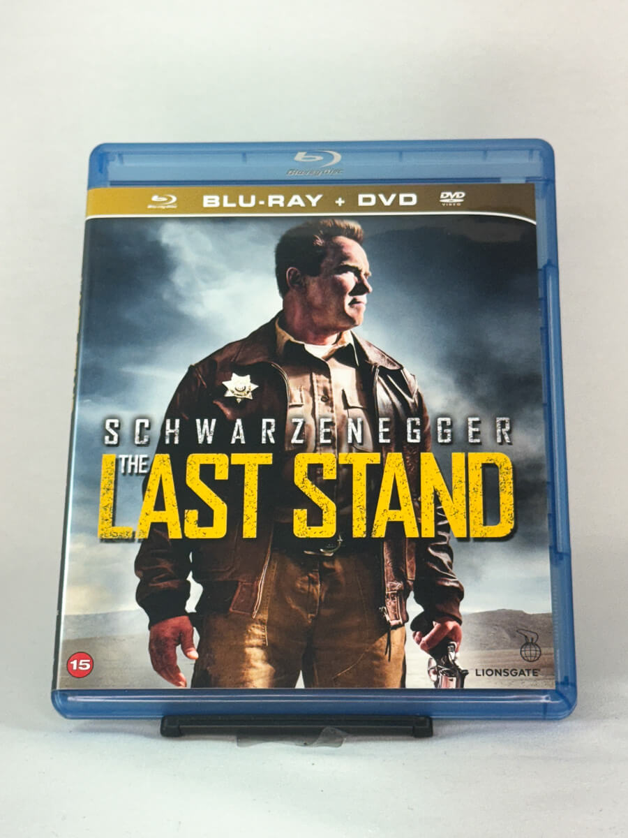 Forside av Blu-ray-cover til The Last Stand med Arnold Schwarzenegger i hovedrollen – intens actionfilm tilgjengelig på brukt Blu-ray hos Brukbar Film.