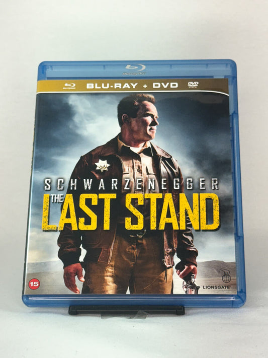 Forside av Blu-ray-cover til The Last Stand med Arnold Schwarzenegger i hovedrollen – intens actionfilm tilgjengelig på brukt Blu-ray hos Brukbar Film.