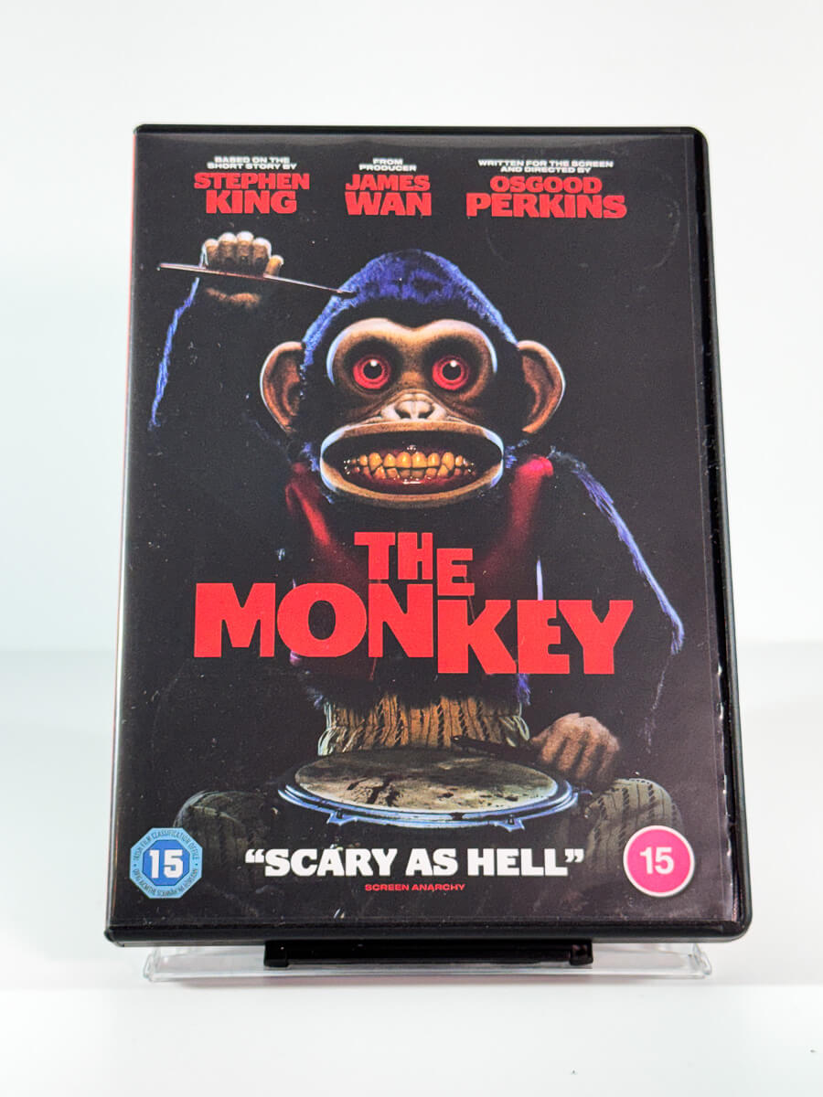 Forside av cover til The Monkey, brukt DVD hos Brukbar Film
