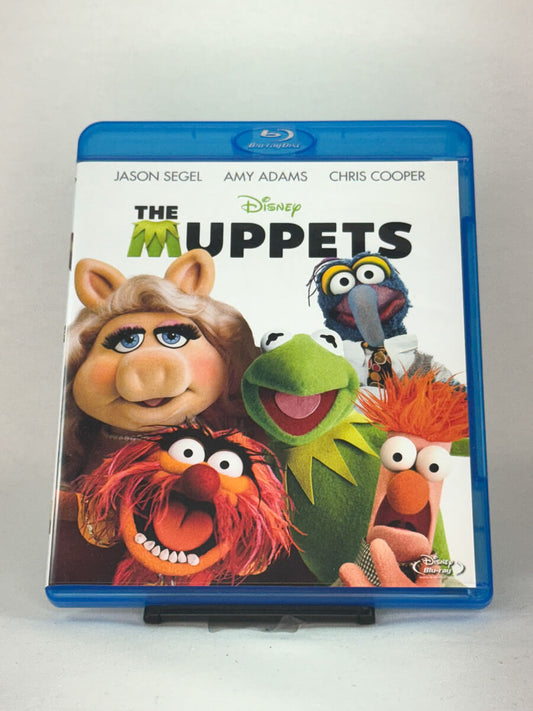 Forside av Blu-ray-cover til The Muppets – Kermit, Miss Piggy og resten av gjengen vender tilbake i en familiekomedie fra Disney, brukt Blu-ray hos Brukbar Film.