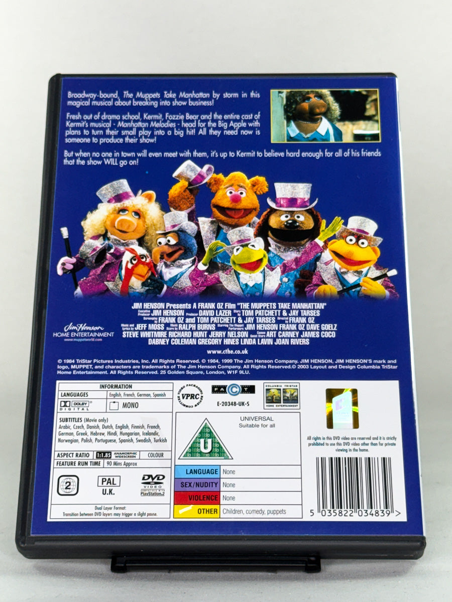 Bakside av DVD-cover til The Muppets Take Manhattan – brukt original Muppets-film, tilgjengelig for samlere av familie- og komediefilmer hos Brukbar Film