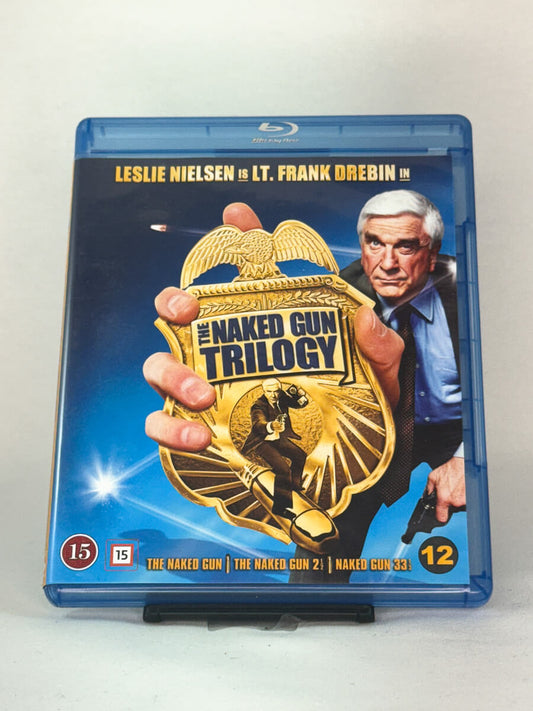 Blu-ray-cover-forside til filmen The Naked Gun Trilogy – Brukt Blu-ray fra nettbutikken Brukbar Film