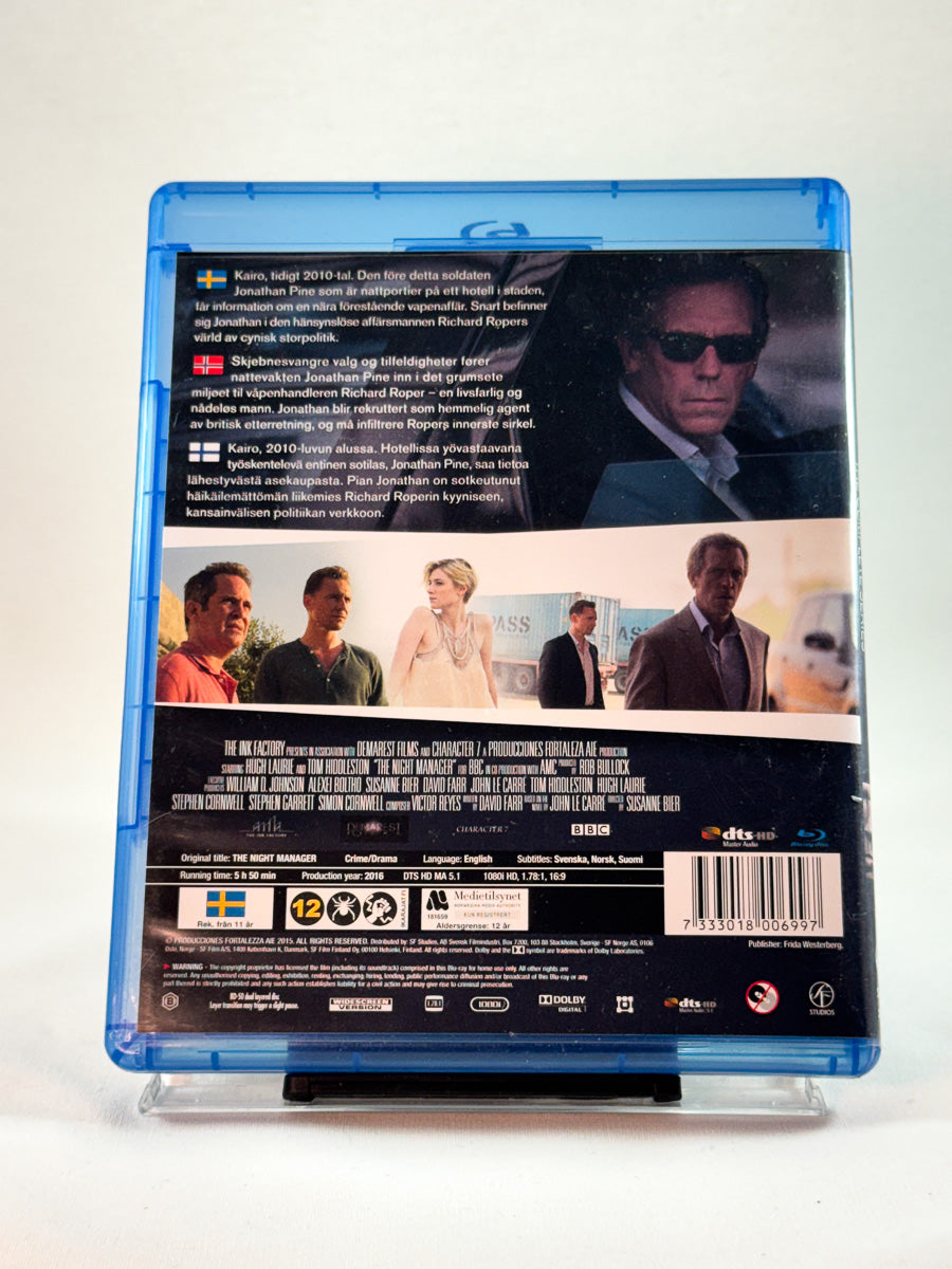 Bakside av Blu-ray-cover til The Night Manager – The Complete Series, bruktfilm på Blu-ray hos Brukbar Film