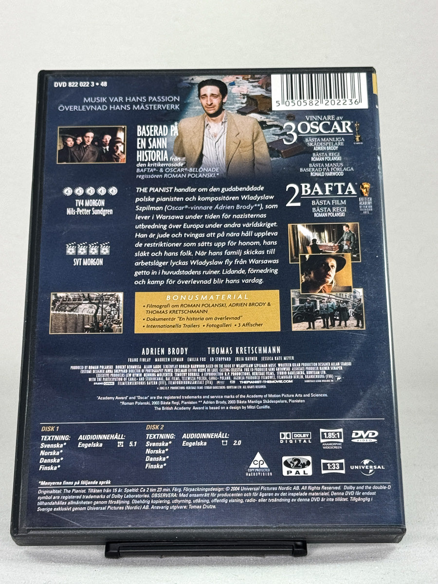 Bakside av DVD-cover til The Pianist med informasjon om filmens innhold; brukt filmutgave tilgjengelig hos Brukbar Film.