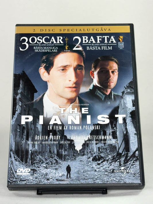 Forside av DVD-cover for filmen The Pianist, et prisvinnende krigsdrama; brukt DVD-film og originalt cover tilgjengelig hos Brukbar Film.
