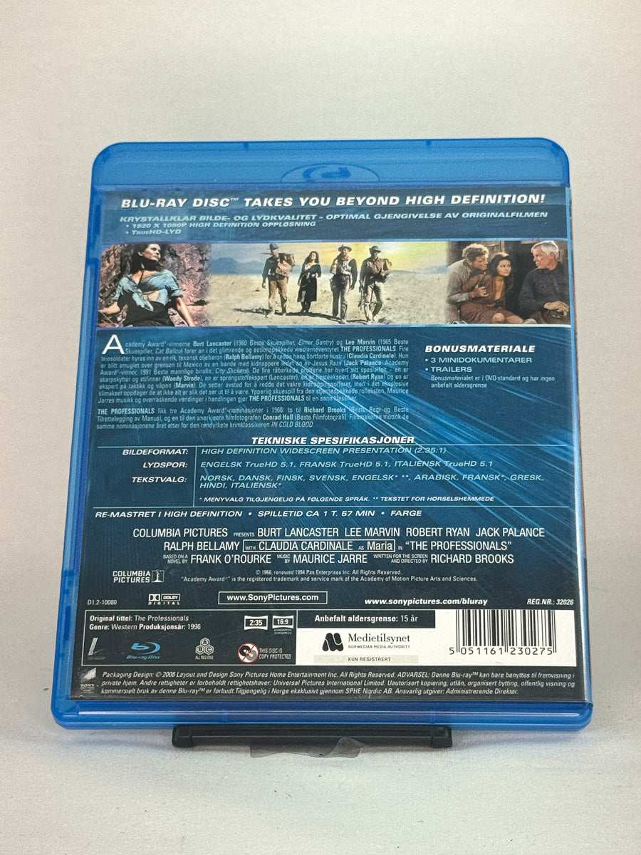 Bakside av Blu-ray-cover til The Professionals – klassisk eventyrfilm fra 60-tallet med Oscar-nominasjoner, brukt Blu-ray-film tilgjengelig hos Brukbar Film.