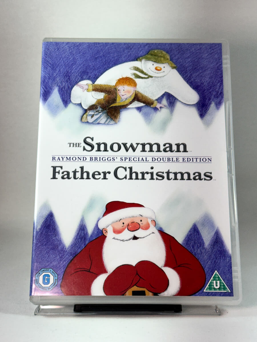 Forside av DVD-cover til The Snowman / Father Christmas, Raymond Briggs’ animerte juleklassikere, brukt DVD hos Brukbar Film