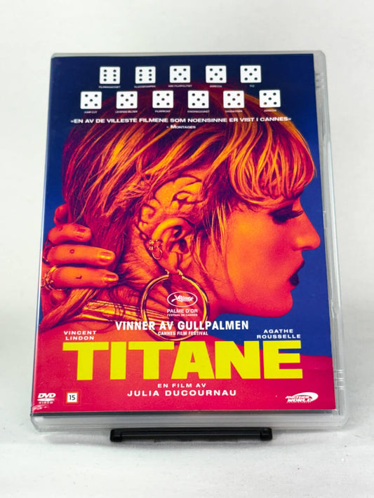 Forside av DVD-cover til Titane – fransk thriller fra 2021 som vant Gullpalmen i Cannes, brukt originalfilm fra Another World Entertainment hos Brukbar Film