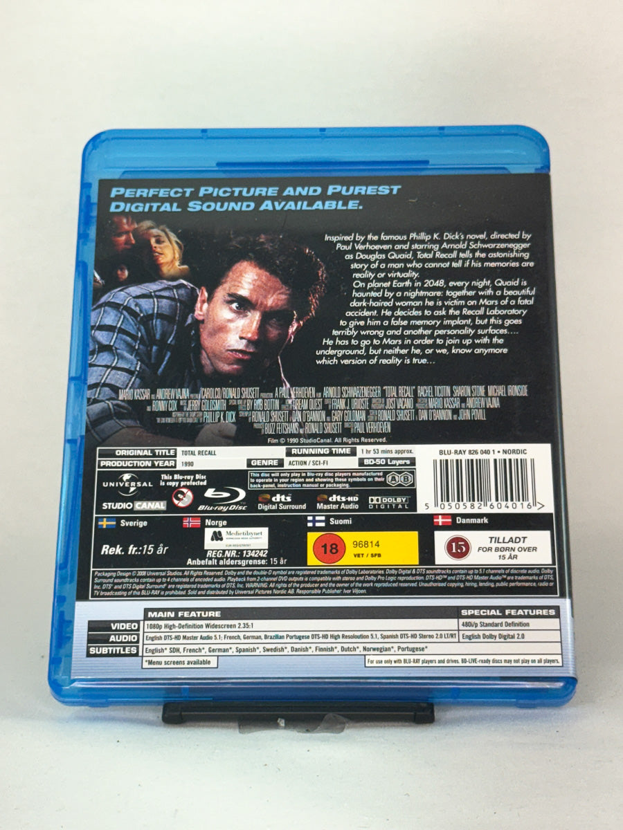 Bakside av Blu-ray-cover for Total Recall – informasjon om handling, bonusmateriale og tekniske spesifikasjoner, brukt film hos Brukbar Film.